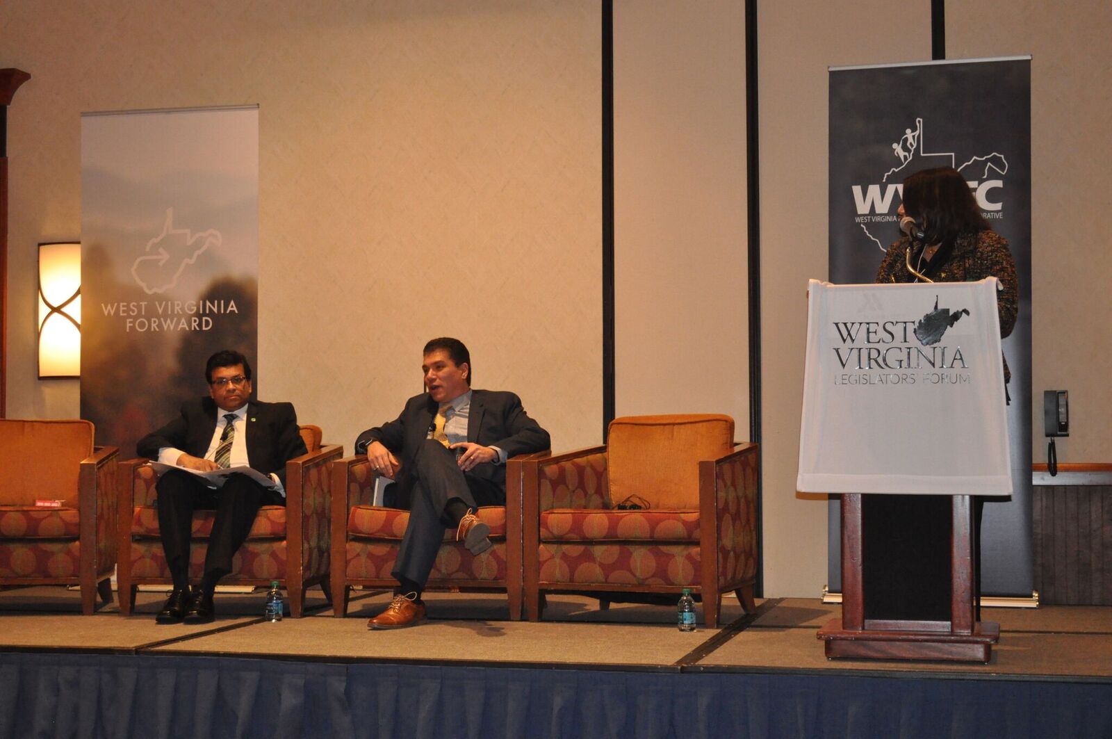Avinandan Mukherjee, Marshall’s Dean of the Lewis College of Business, and Javier Reyes, WVU’s Dean of the John Chambers College of Business and Economics, participate in a panel, moderated by WVU Provost Joyce McConnell, during the WV Legislators' Forum