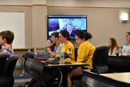 Students discuss with the senator through skype